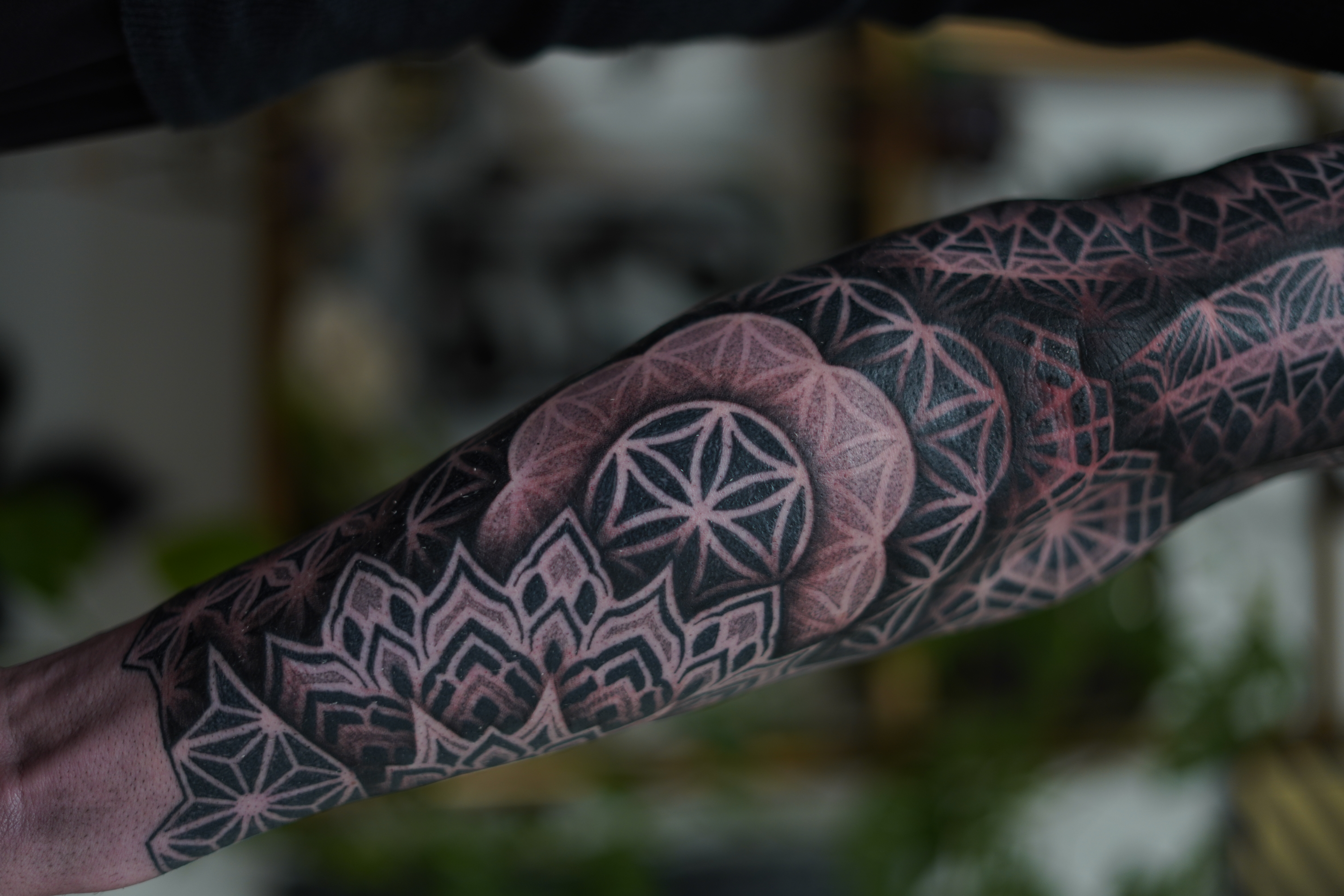 Blackout blast over forearm tattoo by Steve Sherick