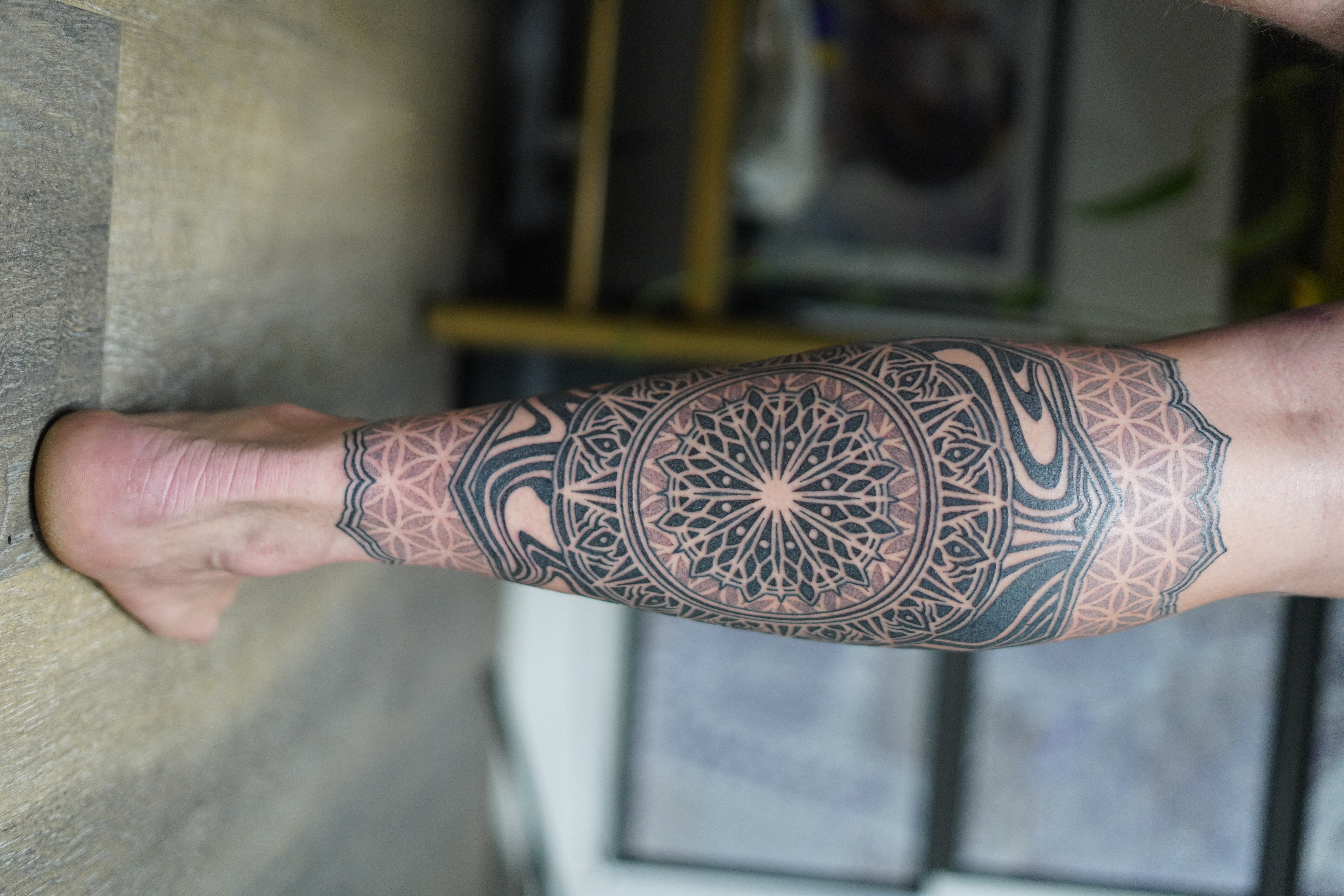 Mandala forearm wrap tattoo by Steve Sherick