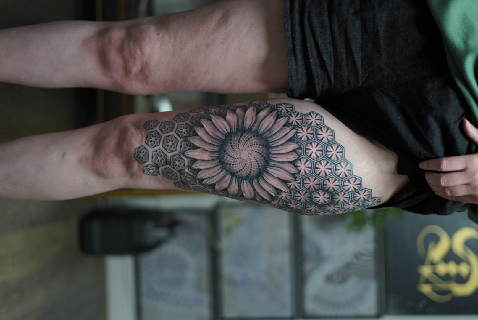Sunflower with sacred geometry and honeycomb forearm tattoo by Steve Sherick