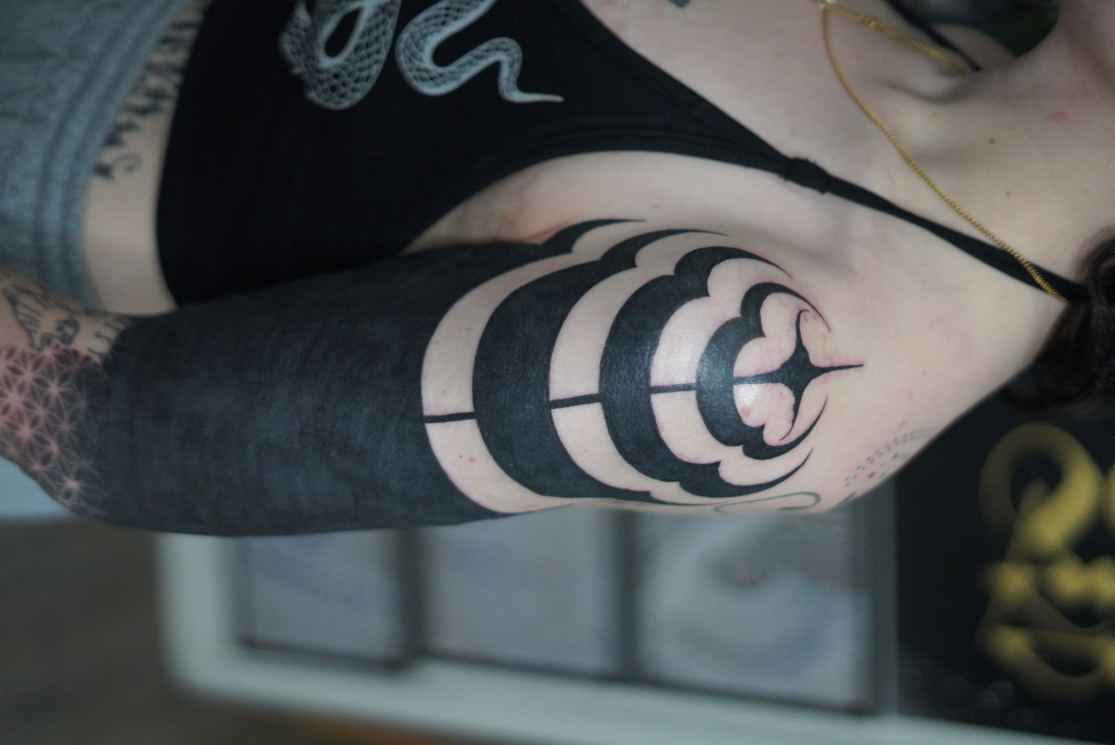 Blackout elbow with bold flower negative space by Steve Sherick
