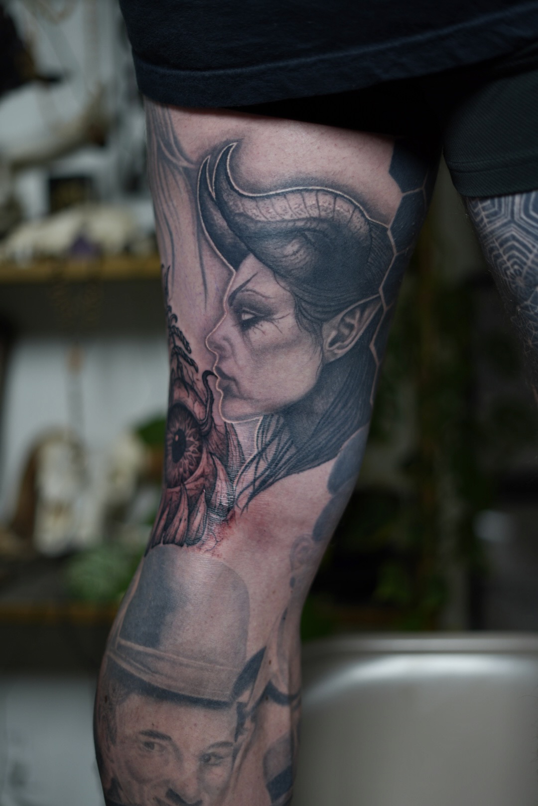 Dark illustrative demon woman leg tattoo by Steve Sherick