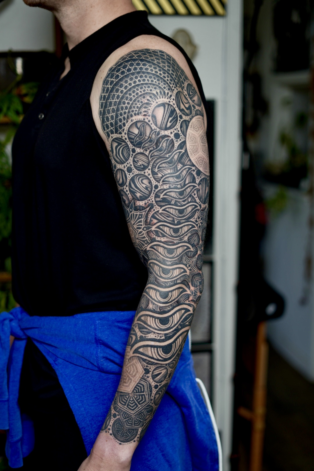 Cosmic blackwork sleeve — planets, sacred geometry and organic forms by Steve Sherick