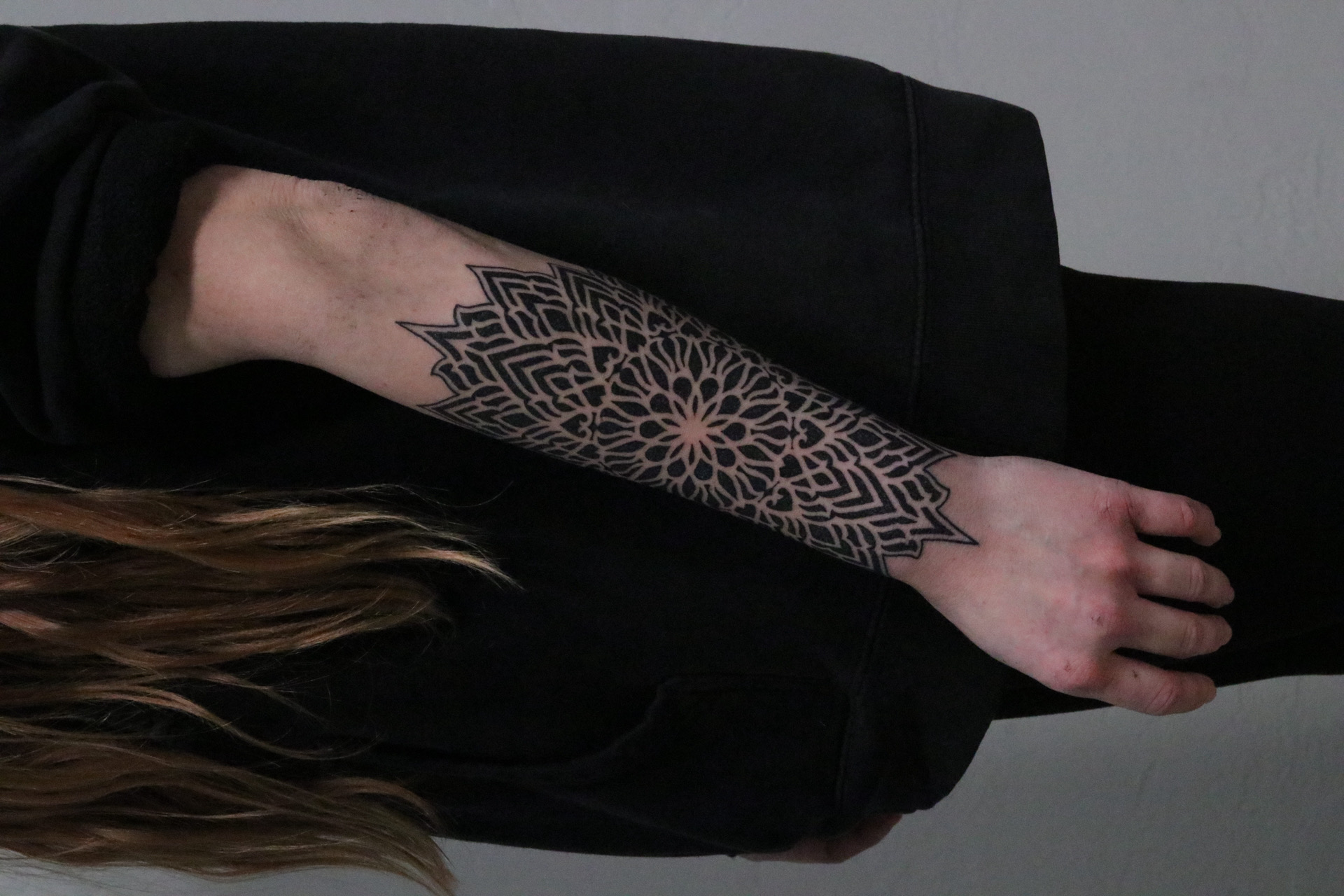 Bold blackwork mandala forearm wrist piece by Steve Sherick